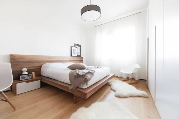 меблировка в интерьере спальни в минималистичной стилистике